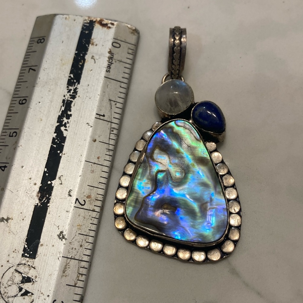 Shell, moonstone, and blue lapis pendant